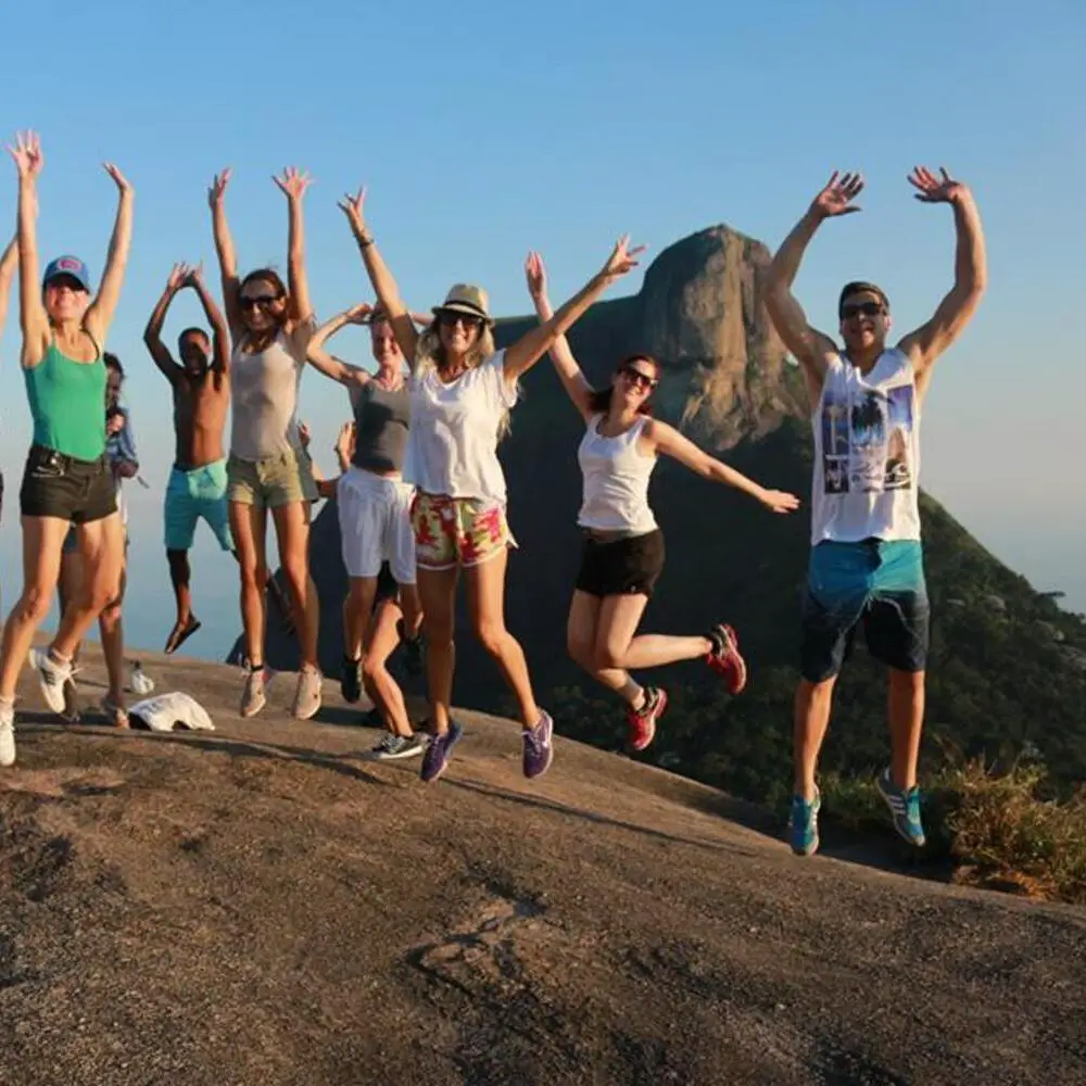 A group of hikers admiring the panoramic views during the Pedro Bonita hike in Rio de Janeiro